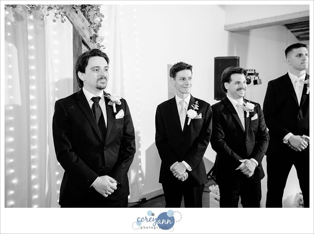 Groom seeing bride for the first time when coming down the aisle at The Barn of Canal Fulton
