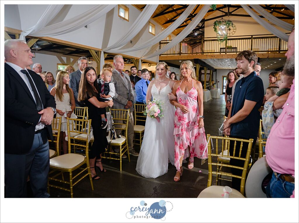 Bride and her Mom walking down the aisle at The Barn of Canal Fulton