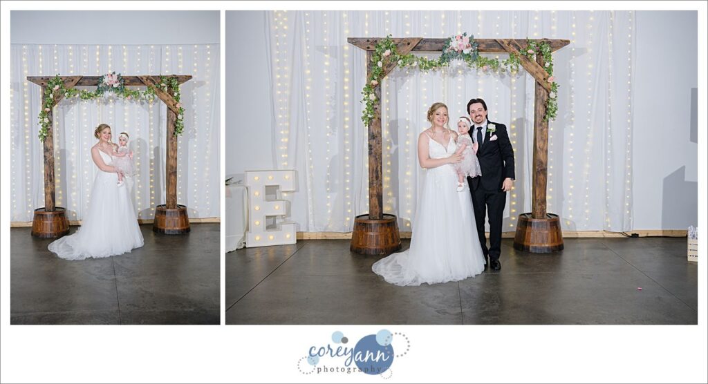 Portraits of Bride and Groom with their daughter at a wedding in Canal Fulton