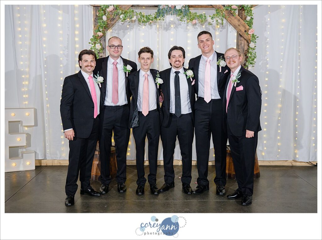Groom and Groomsman wearing pink ties for wedding
