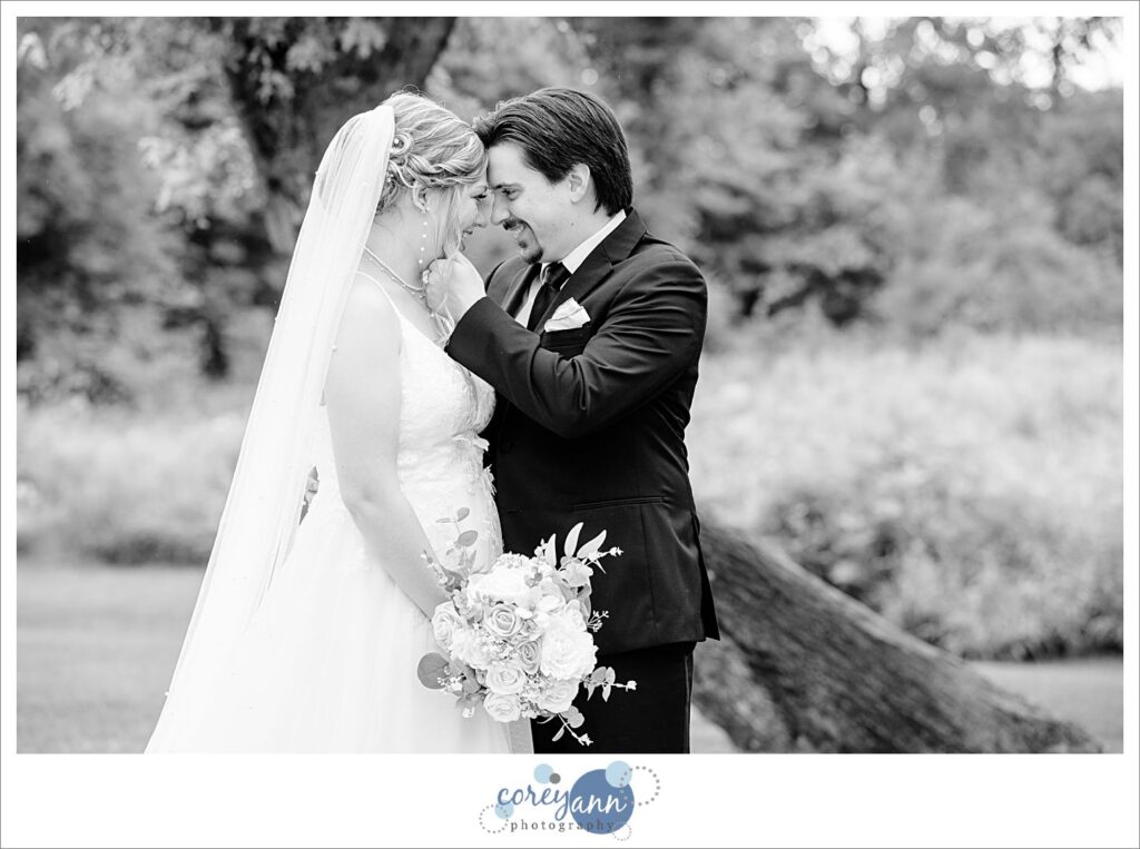 Outdoor photos of bride and groom in the rain at The Barn of Canal Fulton in Ohio