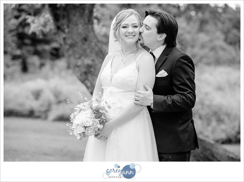 Outdoor photos of bride and groom in the rain at The Barn of Canal Fulton in Ohio
