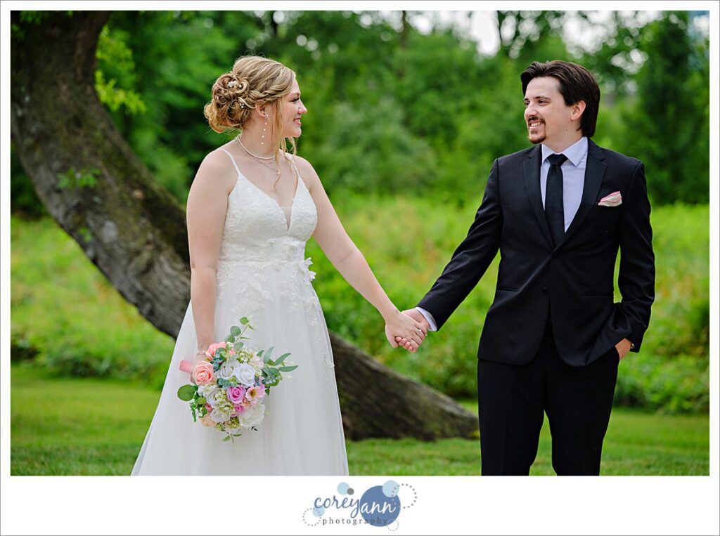 Outdoor photos of bride and groom in the rain at The Barn of Canal Fulton in Ohio