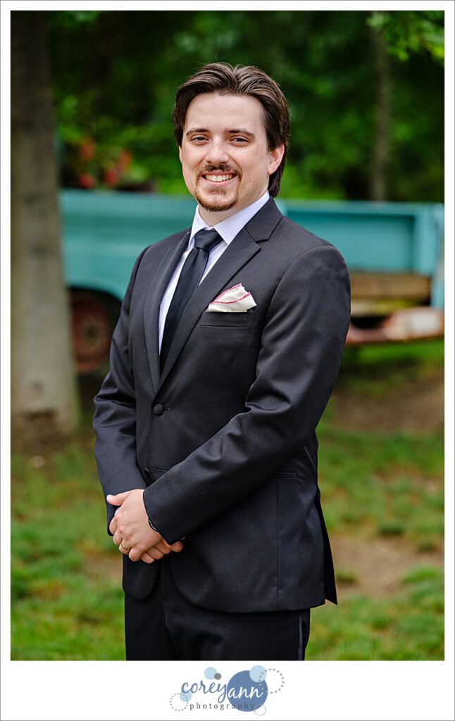 Outdoor photos of bride and groom in the rain at The Barn of Canal Fulton in Ohio