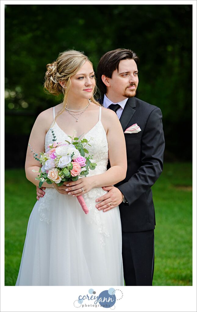 Outdoor photos of bride and groom in the rain at The Barn of Canal Fulton in Ohio