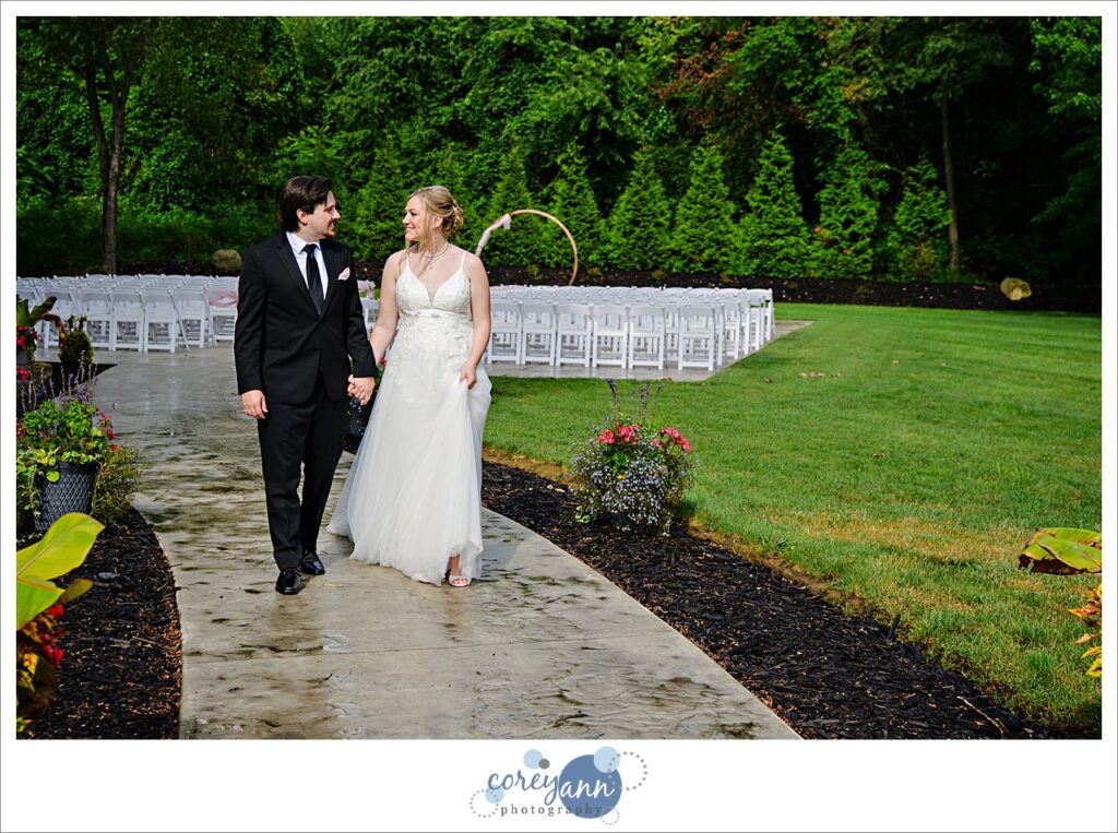 Outdoor photos of bride and groom in the rain at The Barn of Canal Fulton in Ohio