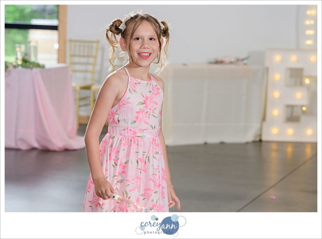 Flower girl at wedding reception at The Barn of Canal Fulton in Ohio