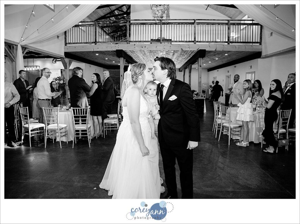 Bride and groom entering their wedding reception at The Barn of Canal Fulton