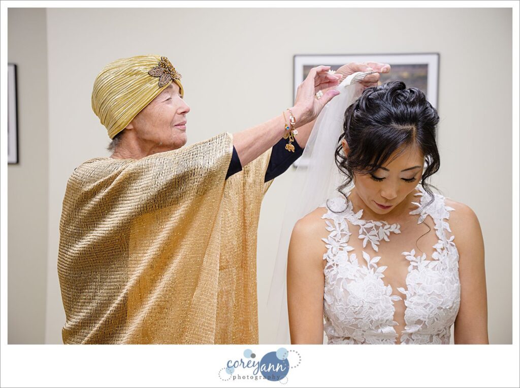 bride getting ready for wedding at pro football hall of fame in Canton ohio