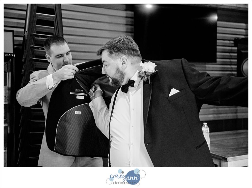 Groom getting ready for wedding at Haymaker's Mill 1875 in North Canton Ohio